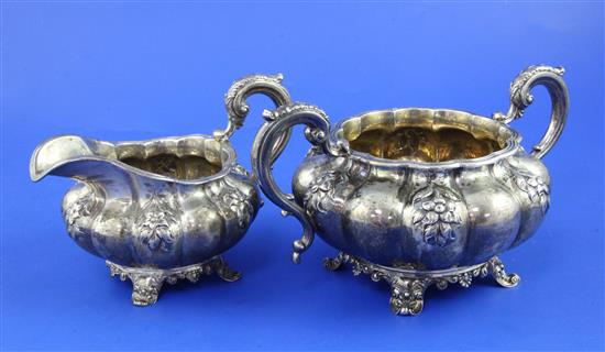 A William IV silver melon shaped two handled sugar bowl and matching cream jug, 20.5 oz.